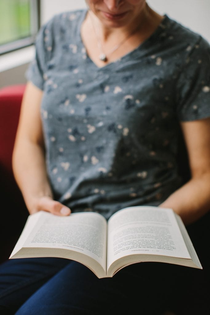 Close up detail of Vancouver business coach reading
