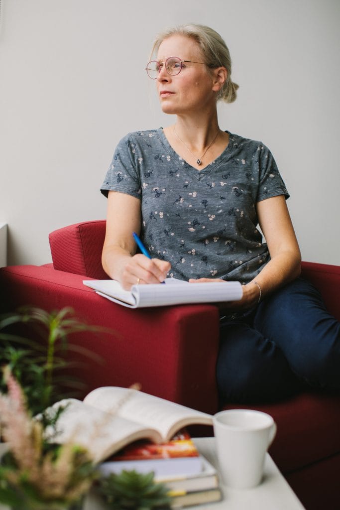 Lifestyle Portrait of business coach studying during personal brand session