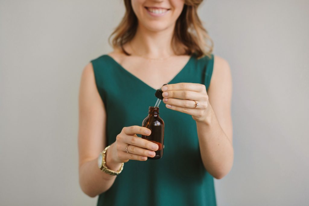 Naturopathic Doctor posing with tincture